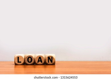 Word Loan cube wood on wooden table white background. 
Financial money loans contract agreement. copy space. - Shutterstock ID 1315624553