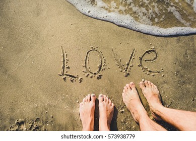 The Word Love On Beach With Wave