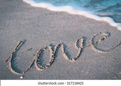 The Word Love On A Tropical Beach