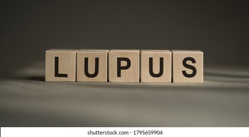 The word lupus from wooden cubes on gray background - Shutterstock ID 1795659904