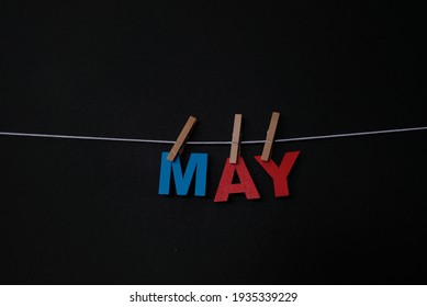 Word May On Black Background. May Is The Fifth Month In Our Modern Day Gregorian Calendar And Also In The Julian Calendar.