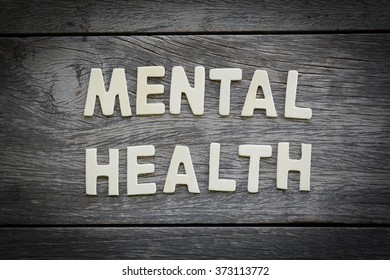 The Word Mental Health On The Wooden Floor