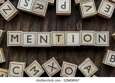 the word of MENTION on building blocks concept - Shutterstock ID 528408967