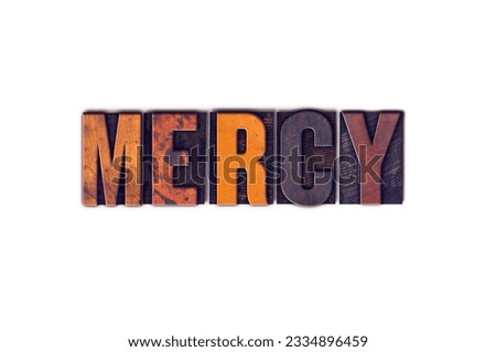 The word -Mercy- written in isolated vintage wooden letterpress type on a white background.