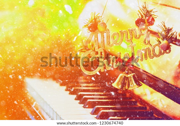 Word Merry Christmas Hanging Over Piano Royalty Free Stock Image