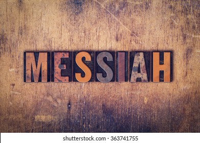 The word "Messiah" written in dirty vintage letterpress type on a aged wooden background. - Shutterstock ID 363741755