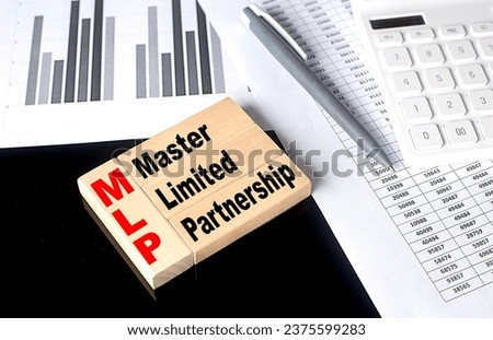 Word MLP - Master Limited Partnership made with wood building blocks, business