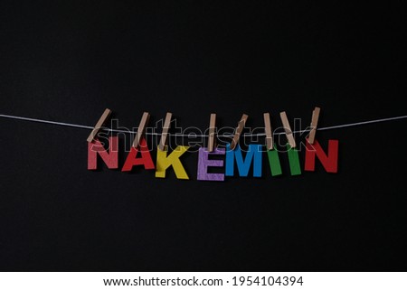 Word Nakemiin on black background. Nakemiin means good bye in Finnish. Concept for art, learning, and education.
