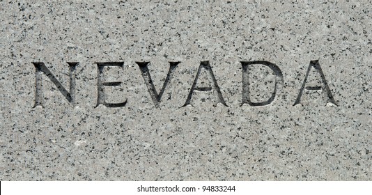 The word "Nevada" carved into granite