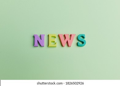 the word -news- is lying on light green background made out of colored letters - Shutterstock ID 1826502926