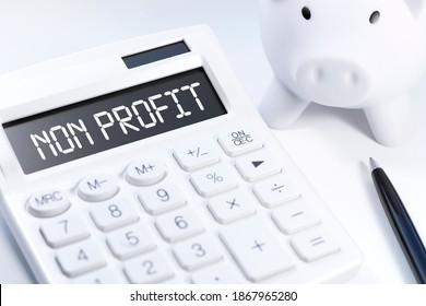 Word NON PROFIT on calculator. Business and tax concept on white background. Top view.