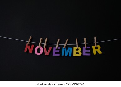 Word November On Black Background. November Is The Eleventh And Penultimate Month Of The Year In The Julian And Gregorian Calendars.