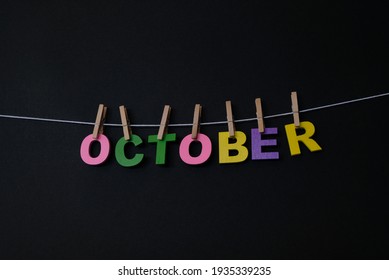 Word October On Black Background. October Is The Tenth Month Of The Year In The Julian And Gregorian Calendars.