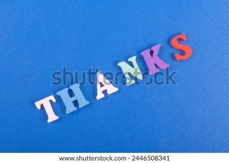 word on blue background composed from colorful abc alphabet block wooden letters, copy space for ad text. Learning english concept