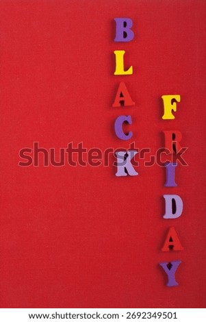 Word on red background composed from colorful abc alphabet block wooden letters, copy space for ad text. Learning english concept