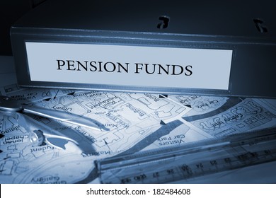 The word pension funds on blue business binder on a desk