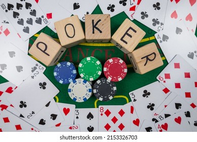 Word Pokerr On Wooden Dice. Poker Cards And Chips On A Green Poker Table. View From Above.gambling