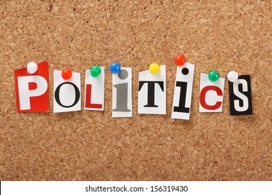 The word Politics in cut out magazine letters pinned to a cork notice board. 