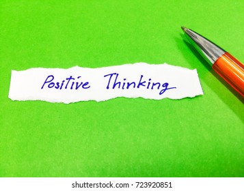Word Positive Thinking message write on white paper on green paper background. Attitude mindset concept