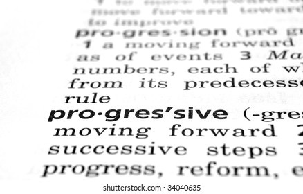 The word Progressive in a dictionary, close-up