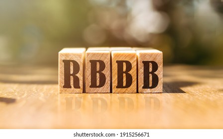 Word RBBB - Right Bundle Branch Block. Made With Building Wooden Blocks On Table In Sunlight.