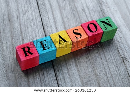 word reason on colorful wooden cubes