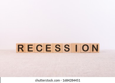 Word RECESSION is made of wooden building blocks lying on a light background. - Shutterstock ID 1684284451