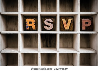 The word "RSVP" written in vintage ink stained wooden letterpress type in a partitioned printer's drawer. - Shutterstock ID 352796639