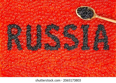 Word Russia Written By Black Caviar On Background Of Red Caviar With Spoon