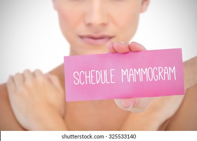 The word schedule mammogram and young woman holding blank card against white background with vignette