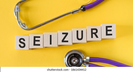 The word SEIZURE from wooden cubes on yellow table with stethoscope. - Shutterstock ID 1861434412
