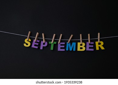 Word September On Black Background. September Is The Ninth Month Of The Year In The Julian And Gregorian Calendars.