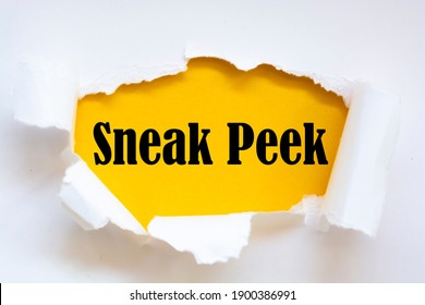The word sneak peek appearing behind torn paper. - Shutterstock ID 1900386991