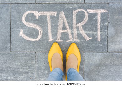 Word start on the asphalt and feet woman - Shutterstock ID 1082584256