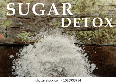 Word SUGAR DETOX With White Sugar On Wooden Background