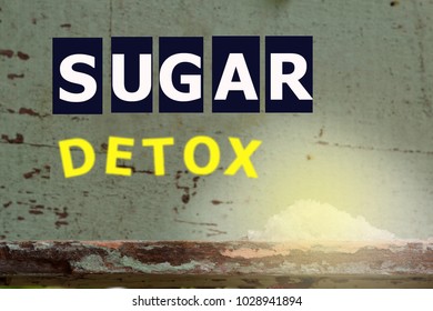 Word SUGAR DETOX With White Sugar On Wooden Background