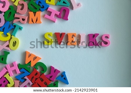 Word 'Sveiks' on white background. Sveiks is the word for Latvian say Hello or greetings.
