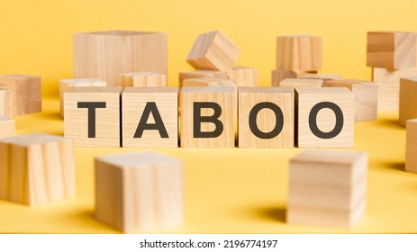 The Word Taboo Written On Wooden Cubes On Yellow Background. Asset Management Or Financial Accounting Concept