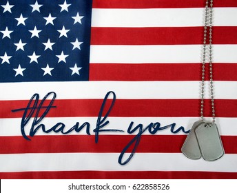 Word Thank You And Military Dog Tags On American Flag Background