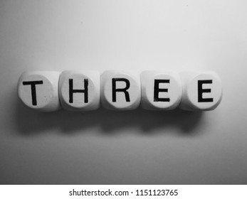 word three spelled in dice