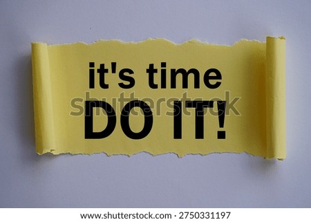 The word it's time, do it on torn yellow paper, self-development concept, act immediately, don't delay
