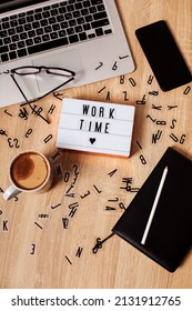 The word time to work. lightbox with the message time to work. Coffee mug, glasses, notebook. flat lay snapshot Business, career or working hard concept. High quality photo