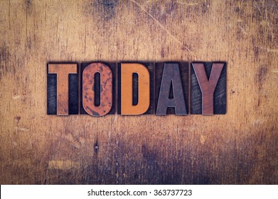 The word "Today" written in dirty vintage letterpress type on a aged wooden background. - Shutterstock ID 363737723