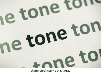 Word Tone Printed On White Paper Macro