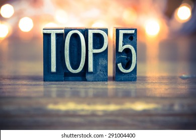 The word TOP 5 written in vintage metal letterpress type on a soft backlit background. - Shutterstock ID 291004400