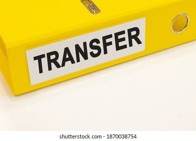The word transfer on a white background with a yellow folder. Business concept