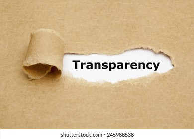 The Word Transparency Appearing Behind Torn Brown Paper. 