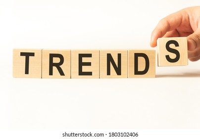 Word trends. Wooden small cubes with letters isolated on white background with copy space available.Business Concept image. - Shutterstock ID 1803102406