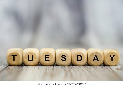 The Word Tuesday On Wooden Cubes. Weekday Concept.