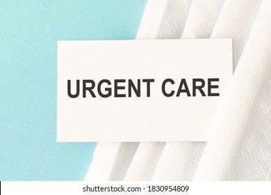 Word Urgent Care With Medical Mask On A Blue Background. Preventive Medicine